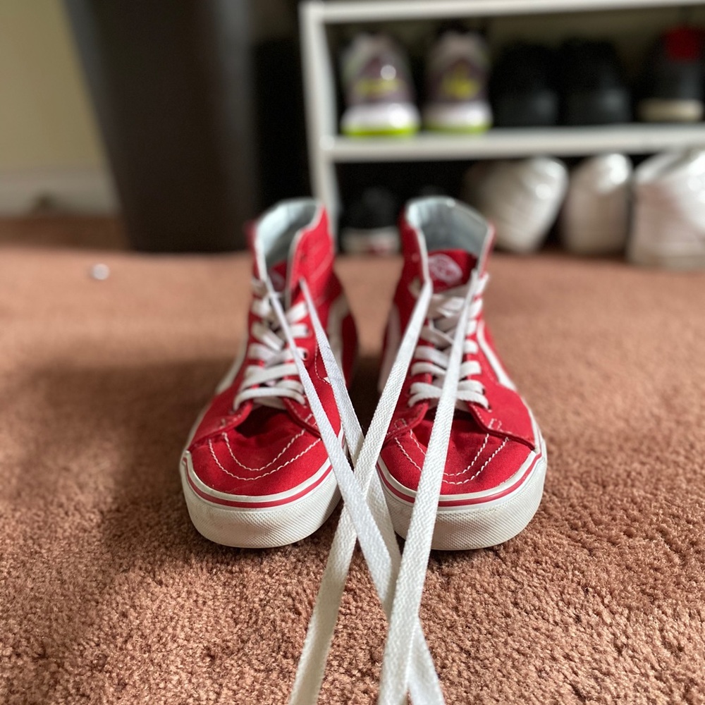 Red and white high top Vans